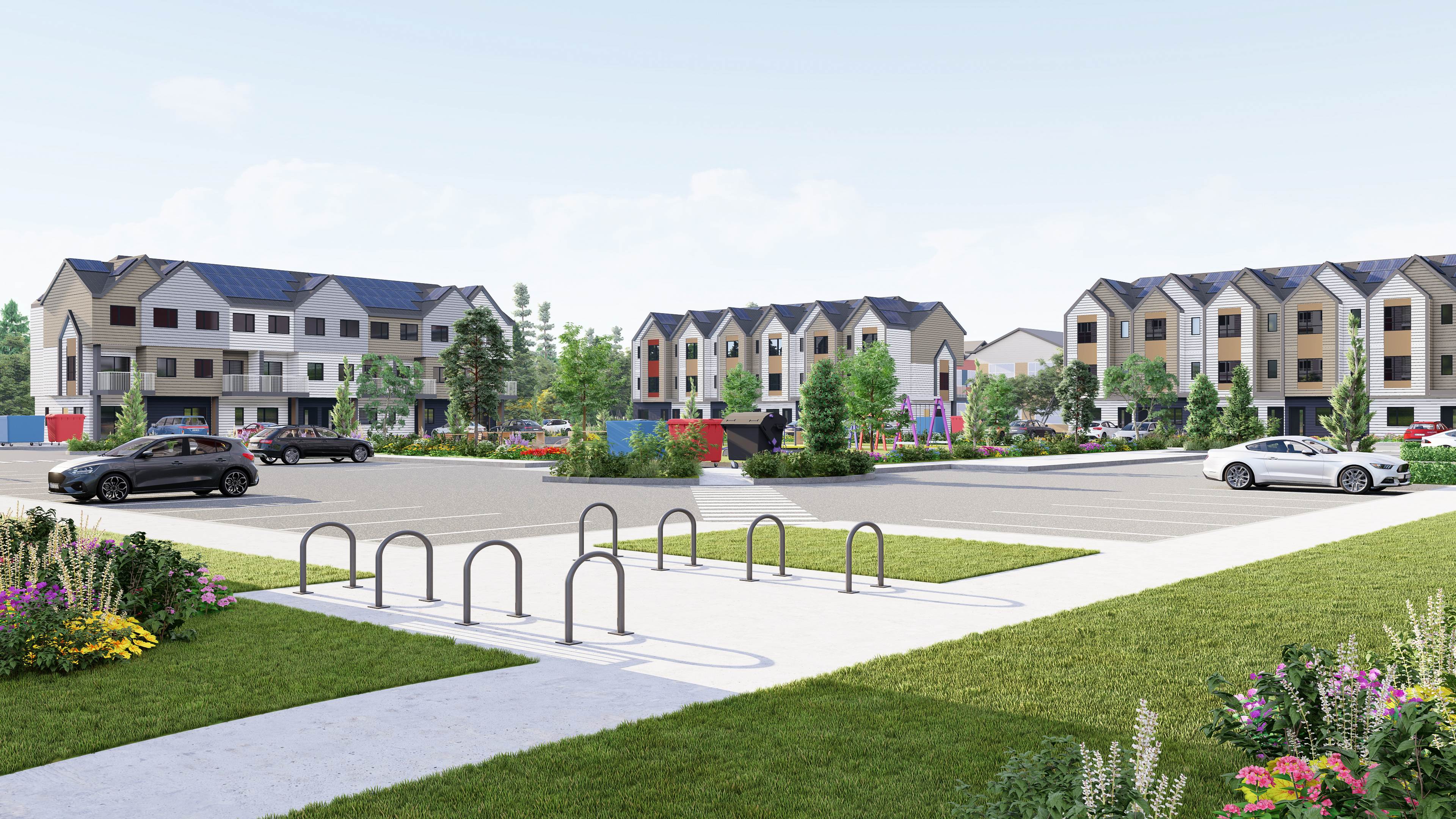 Blue Quill Community showing modern apartment buildings with solar panels and landscaped community spaces